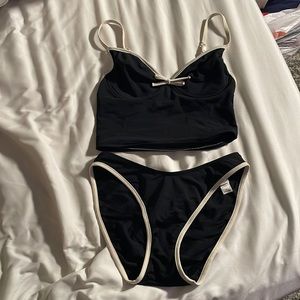 women’s black and white victoria secret bikini, top is 34B, bottom is M